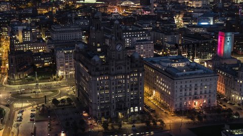 Aerial View Shot of Liverpool at night evening, historic  Royal Liver Building, United Kingdom