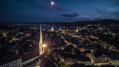 Aerial View Shot of Zurich, Wide Establishing at night evening, Old Town, Switzerland, moon up