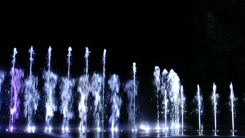 Colorful water fountain dance show with laser light