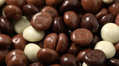 White and brown traditional chocolate covered Dutch kruidnoten,  spiced cookies, full frame close up for sinterklaas evening