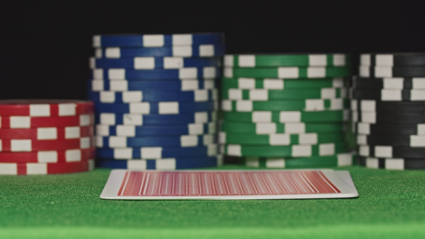 Pocket aces in a deck of playing cards with poker chips Royalty-Free Stock Footage #1061720566
