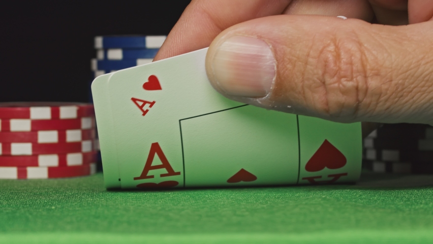 Pocket aces in a deck of playing cards with poker chips Royalty-Free Stock Footage #1061720566