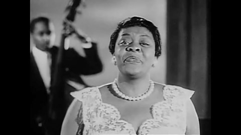 CIRCA 1955 - Dinah Washington concludes a performance of "Only a Moment Ago" at the Harlem Variety Revue.