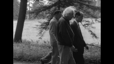 CIRCA 1954 - Albert Einstein and Nobel laureate Hideki Yukawa go for a walk in a forest with other Princeton professors of science.
