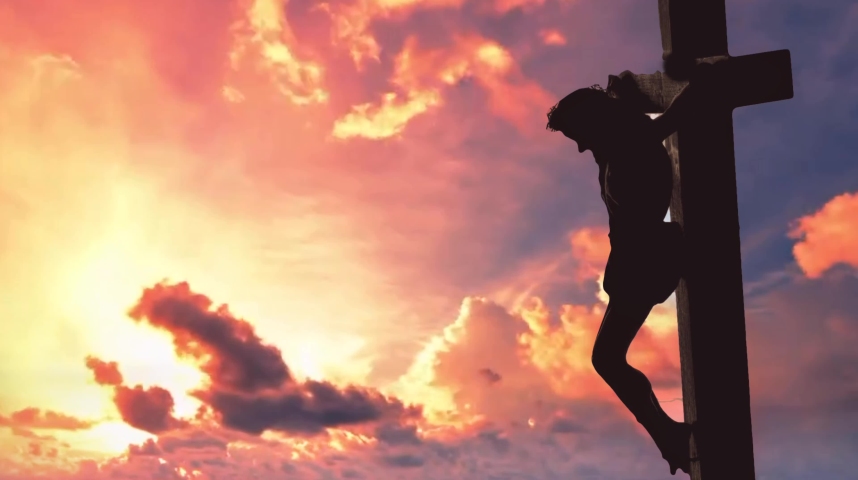 The scene of Jesus on the cross at sunset is a powerful and poignant one, filled with symbolism and meaning. In this image, Jesus is depicted as he hangs on the cross, his body battered and bruised. Royalty-Free Stock Footage #1061722858