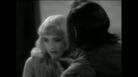 CIRCA 1931 - In this horror film, a young woman resists a hypnotist (John Barrymore) by running away.