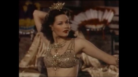 CIRCA 1945 - In this drama film, cowboys leer at a sexy dancer in a tavern.