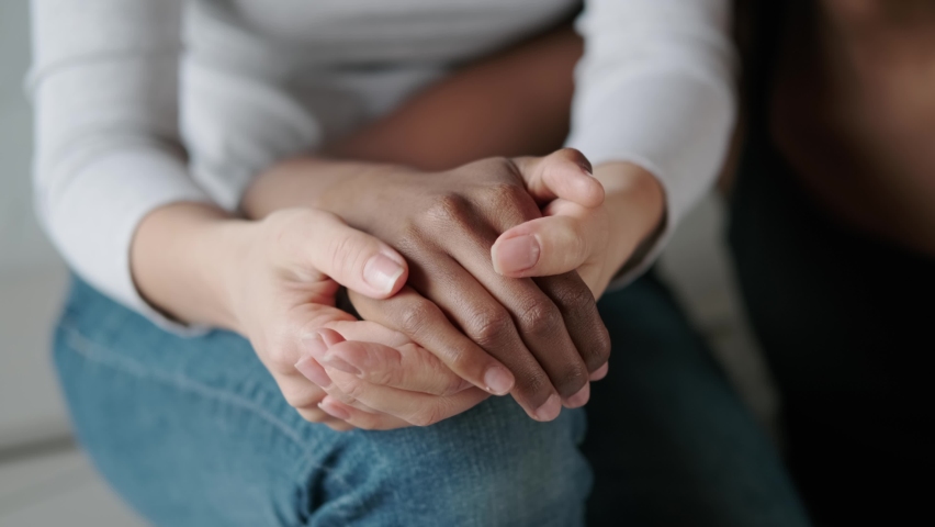 Female hands close up. Lesbian couple holding hands Royalty-Free Stock Footage #1061726764