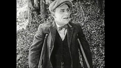 CIRCA 1923 - In this drama film, a disabled man (Lon Chaney) is heartbroken to see the woman he loves kiss another man.