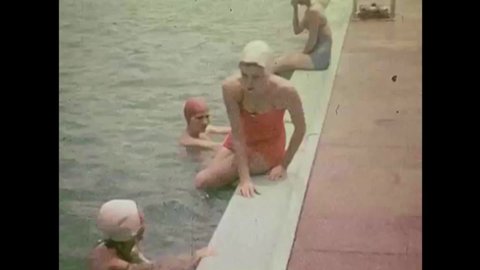 CIRCA 1950s - People swim and dive in a pool in Elizabeth City, North Carolina during the Potato Festival in the 1950s.