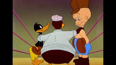 CIRCA 1943 - A boxing referee outlines prohibited tactics in a match by demonstrating them on Elmer Fudd, and Daffy Duck follows suit.