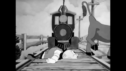 CIRCA 1939 - Train conductor Porky Pig is able to evade a fast locomotive but has trouble with a stubborn cow eating on the tracks.