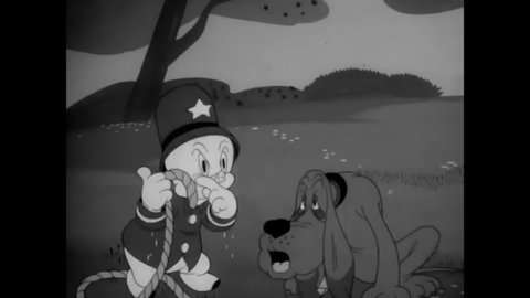 CIRCA 1943 - In this animated film, a Nazi spy disguises himself as policeman Porky Pig to get Porky away from a railroad he intends to blow up.