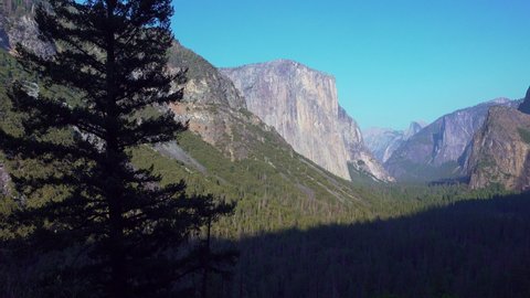 YOSEMITE NATIONAL PARK - CIRCA 2020 - Horizontal pan across the scenic Yosemite Valley, including El Capitan and Cathedral Peaks, Yosemite NP, CA.