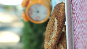 Turkish bagel and an orange clock.Video for the vertical story.