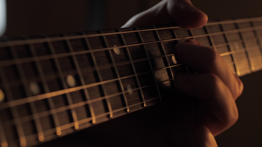 Playing electric guitar fretboard closeup | Shutterstock HD Video #1061744470