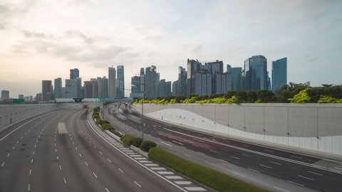 Time lapse video 4K, Traffic view with background Singapore landmark financial business district with skyscraper, traffic in main street.