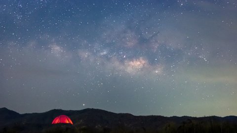 Red tent under Milky Way Galaxy Time Lapse Lampang Thailand, Universe galaxy milky way time lapse, dark milky way, galaxy view, star lines, timelapse night sky stars on sky background. 4K Resolution.