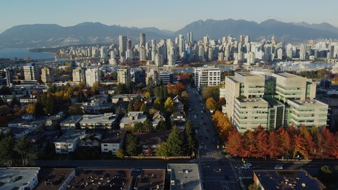 Aerial view of autumn crossroad with downtown of Vancouver on the back