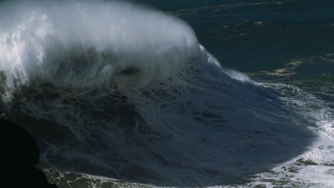 Slow motion of a monster wave in Nazaré, Portugal. Nazaré is a small village in Portugal with the biggest waves in the world.