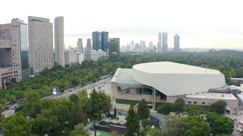 Mexico city - september 12, 2019:  Panoramic aerial view of the famous National Auditorium on one side of the busy Reforma avenue surrounded by the Chapultepec forest
