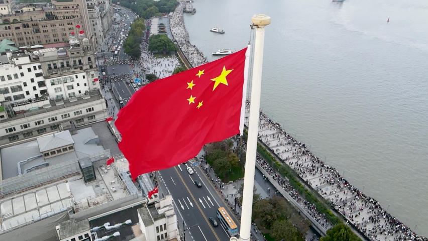 Slow motion Chinese National Flag Landmark building and the Bund, in downtown in National Day Economy business concept b-roll footage China's 5 star national flag in the wind in the World Architecture | Shutterstock HD Video #1061765155