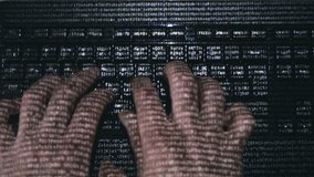 Male hands (hacker) quickly type on a computer keyboard on the surface of which various letters and numbers run, symbolizing the modern digital world - Powered by Shutterstock - Get 15% off with code: PIKWIZARD15