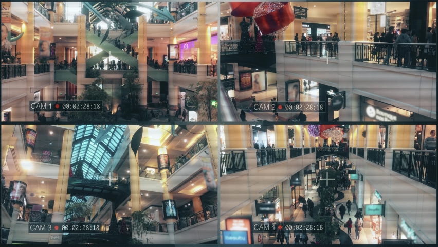 Mall Security Cameras CCTV System Monitor. CCTV cameras surveillance system in a crowded shopping mall. Multiscreen monitor. Royalty-Free Stock Footage #1061776468