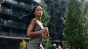 African american active fitness woman runner jogging in sunny street summer day outdoors. Jogger activity. Female athlete. Sportswoman. Cardio exercises. Workout concept. - Powered by Shutterstock - Get 15% off with code: PIKWIZARD15