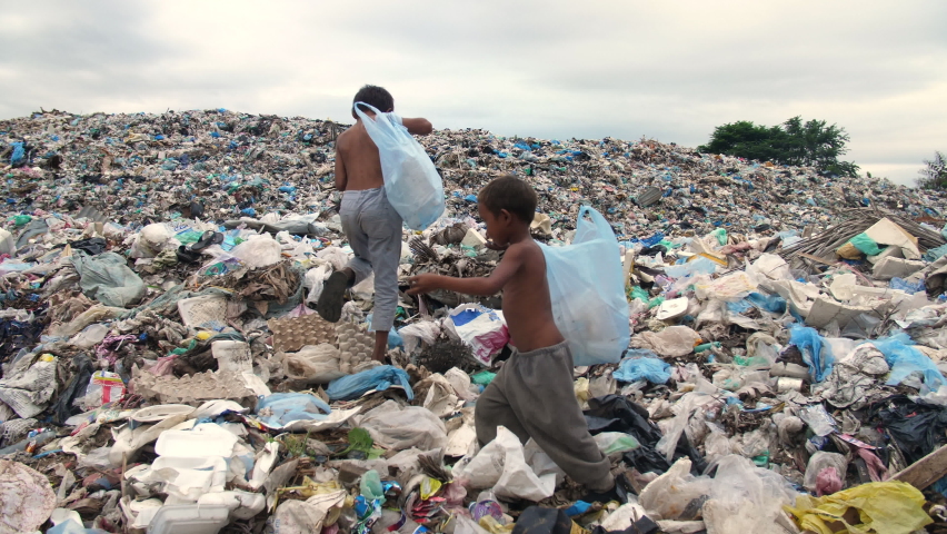 Poor Children Walking On Garbage Dump
 Royalty-Free Stock Footage #1061785519
