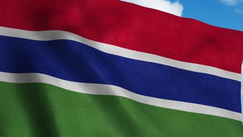Gambia flag waving in the wind, blue sky background. 4K