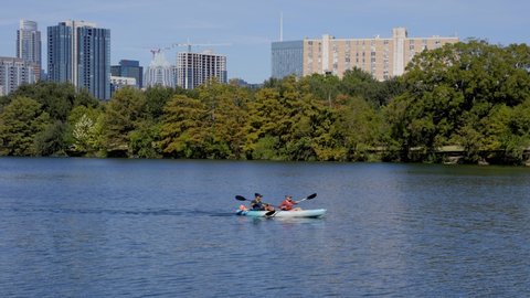 Slow Motion of Kayakers on Lady Bird Lake River Near Austin, Texas Downtown City