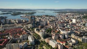 Oslo, Norway. Beautiful 4K panoramic aerial video from flying drone to Oslo city center. Against the background of the sea, mountains and blue sky on a sunny summer day. (Series)