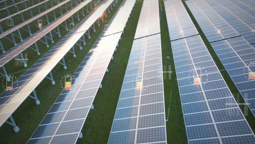 Solar panel farm generating electricity for national grid with a motion graphic indicator of battery charging. New green energy concept Royalty-Free Stock Footage #1061806084