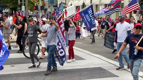 Beverly Hills , CA / United States - 10 31 2020: Trump supporters, American Flag, rally campaign on Rodeo Drive in Beverly Hills