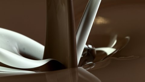 Super slow motion of hot chocolate mixing with pouring milk. Filmed on high speed cinema camera, 1000fps.