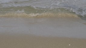 4K Video close up woman's foot walking alone on the beach. concept for holiday vacation and relaxing.