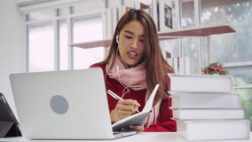 close up young cute asian woman studying online course by using laptop portable after work or talking with friends in application, diligent people and social distance in quarantine time concept