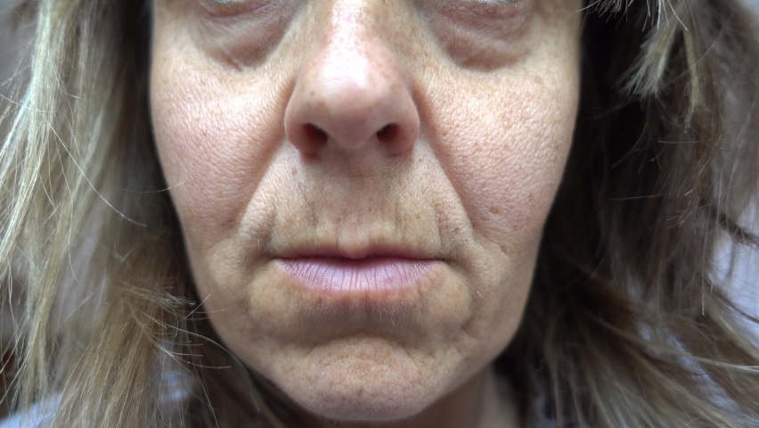 4K Lower face of aging woman with starting jowls, close up
 Royalty-Free Stock Footage #1061810968
