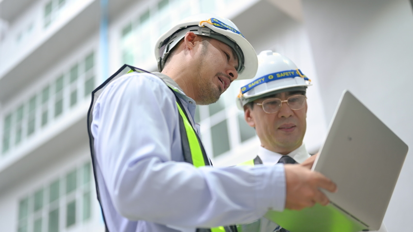 Male engineer was talking to management about the construction and structure of the factory.Architect and engineer concept.