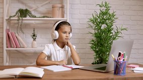 Little girl using laptop computer for studying online e-learning system. online education concept