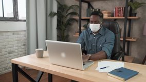 Smiling business black american man with face mask working from home. Remote chatting colleague internet online meeting conference webinar. Distance work webcam. Coronavirus health care 4k - Powered by Shutterstock - Get 15% off with code: PIKWIZARD15