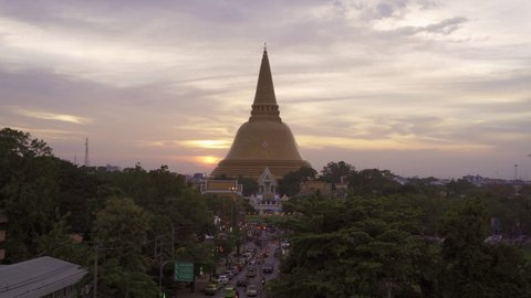 Aerial view of Phra Pathom Chedi stupa temple in Nakhon Pathom near Bangkok City, Thailand. Tourist attraction. Thai landmark architecture. Golden pagoda at sunset.