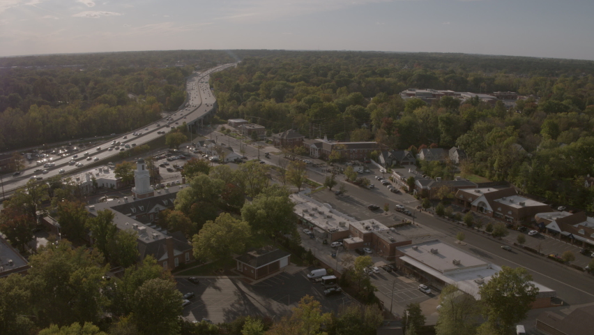Panoramic view with highway and street with shops in neighborhood of St. Louis, Missouri on a Fall day.