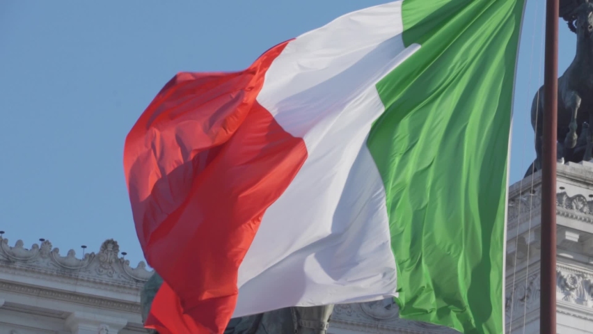Flag of Italy in Slow Motion, Italian Tricolour National Symbol Green, White and Red - in front of Altar of the Fatherland Altare della Patria in The City of Rome