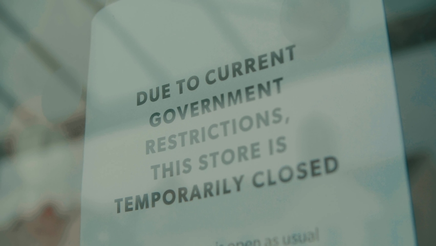 Slow motion shot of independent shop closed until further notice due to the COVID 19 coronavirus pandemic, bars, cafes, restaurants, clubs all shut cause of this international crisis lockdown 2.0  | Shutterstock HD Video #1061829658
