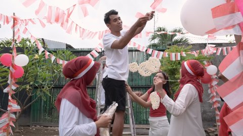 Some people prepare for the Independence Day at home. Concept of Indonesia's independence day