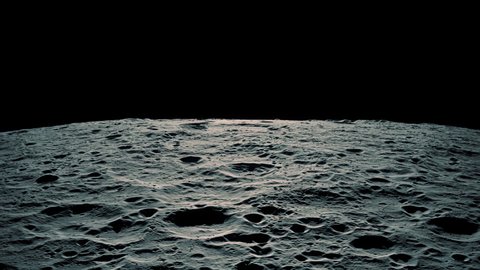 The sun rising over the horizon as viewed from the surface of the moon.