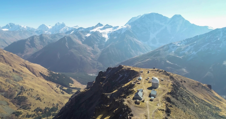 A beautiful panorama of the high mountains in the vicinity of Mount Elbrus. Drone shooting of the landscape and nature of the North Caucasus
