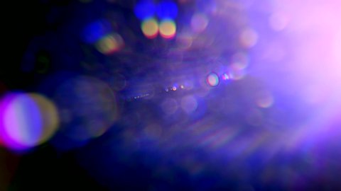 quick lens flare, Light leaks effect background, Lens light leaks flashing around making an elegant abstract background animation, Multicolored light leaks 4k footage on black background